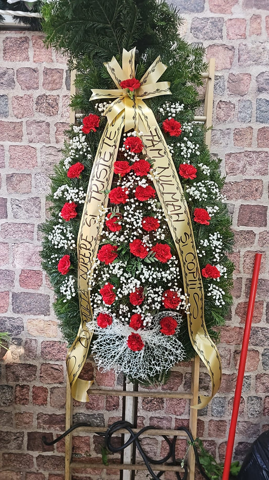 Coroană Funerară cu Garoafe Roșii – Omagiu Plin de Respect și Emoție